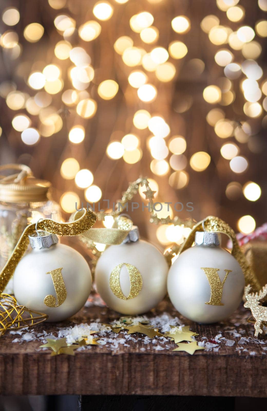 Festive decorations with Christmas baubles in front of cheerful lights