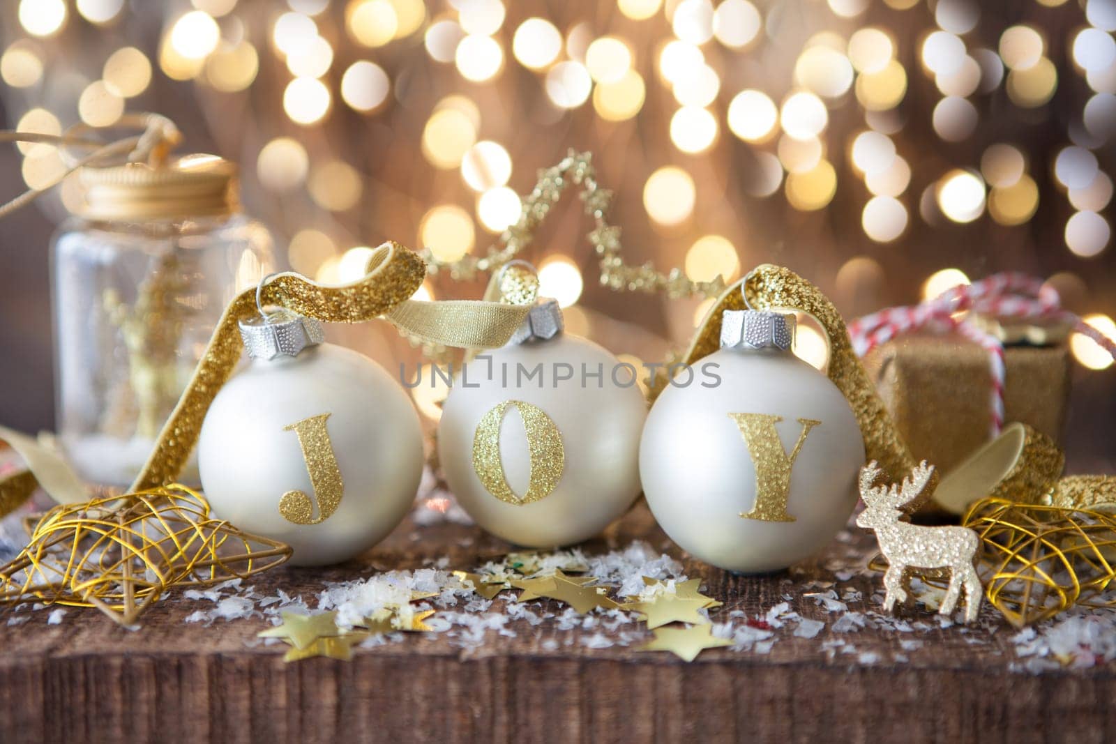 Festive decorations with Christmas baubles in front of cheerful lights
