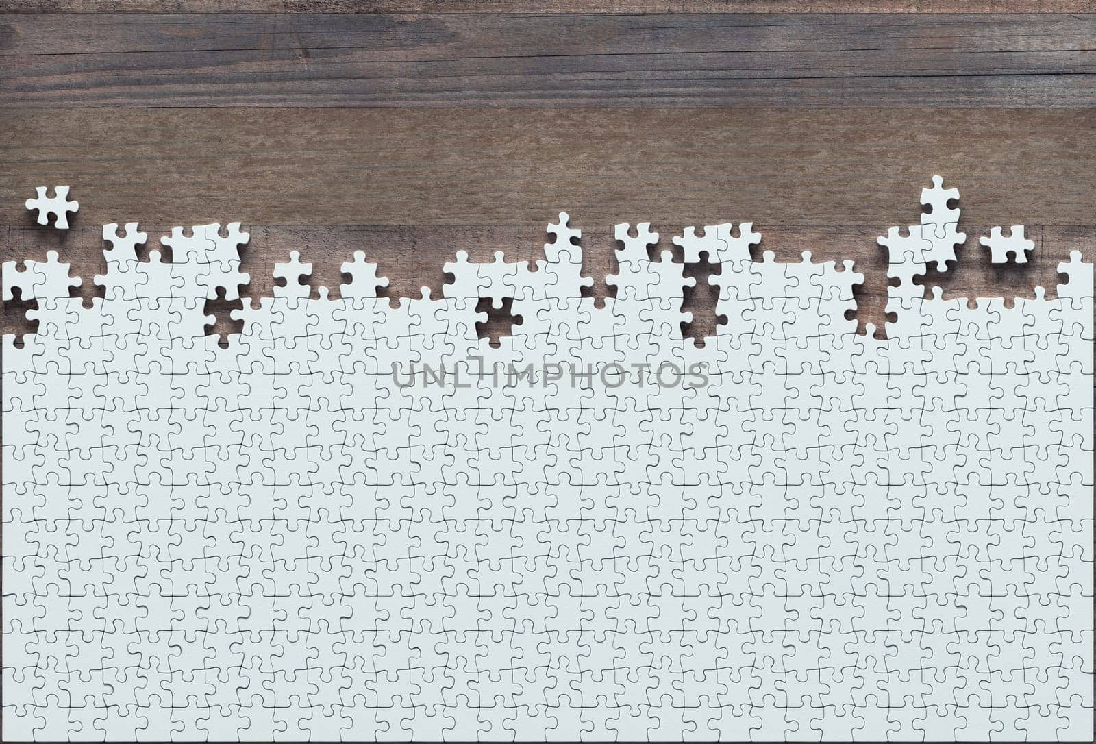 Blank jigsaw puzzle missing half to finish. Concept of work not completed.