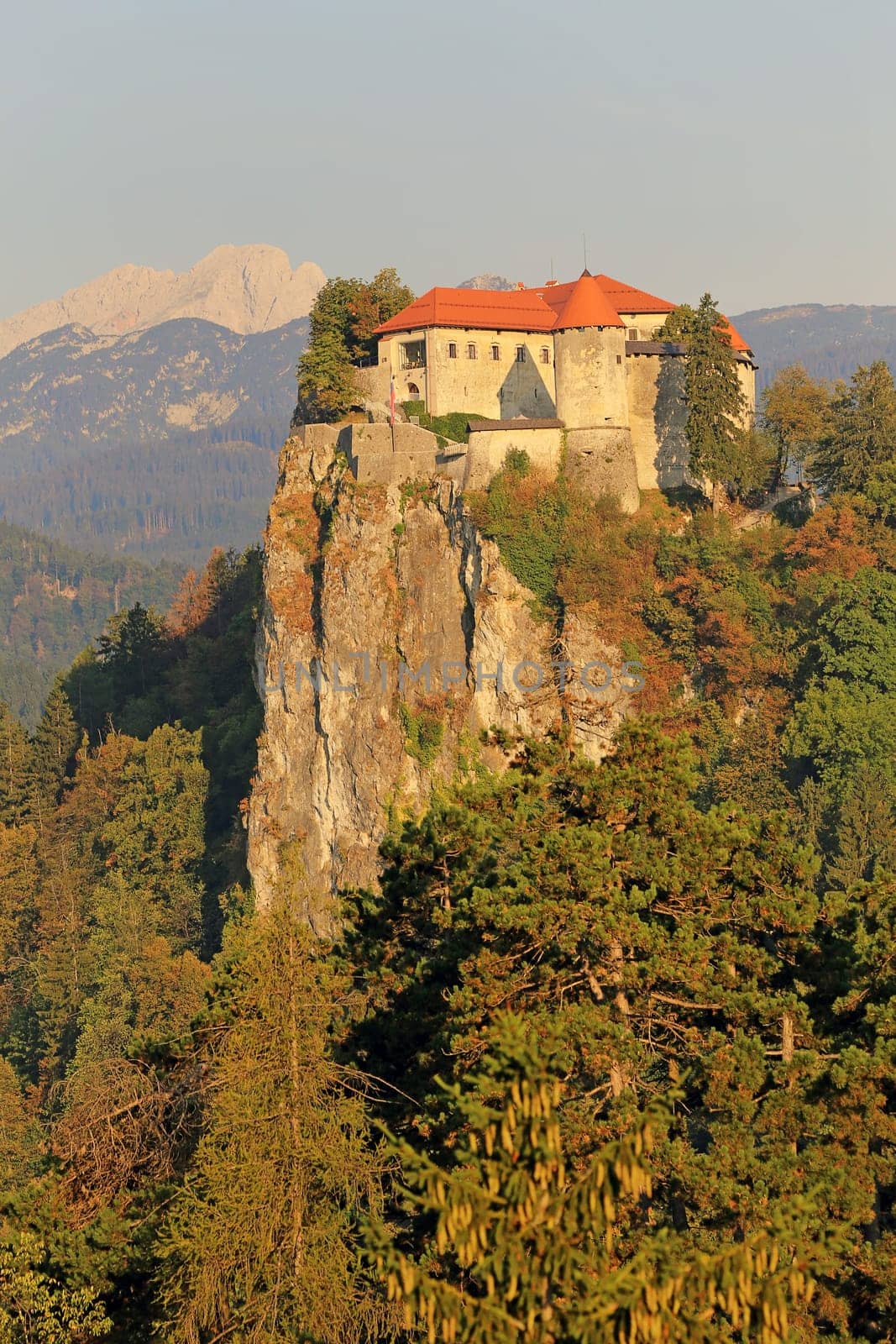 Bled Castle above Lake Bled in Slovenia in front of the Triglav mountain massif