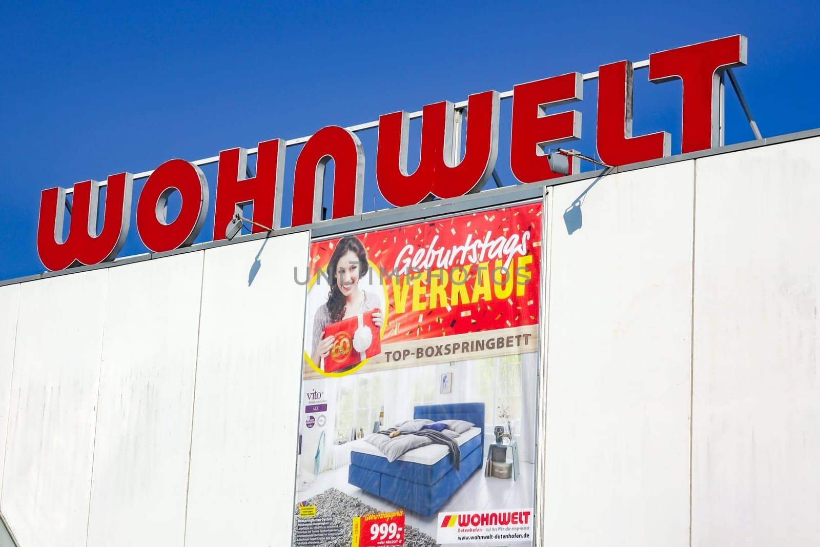 WETZLAR, Germany - March 25, 2018: WOHNWELT logo on a store. WOHNWELT is a German furniture discounter based in WETZLAR, Hessen.