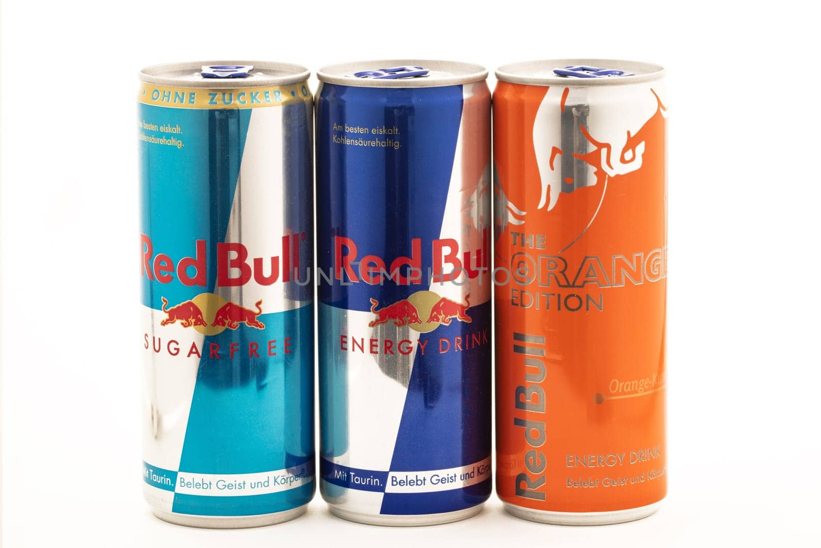 HUETTENBERG, GERMANY - JULY 19 2018: Cans of Red Bull Energy Drinks on white background