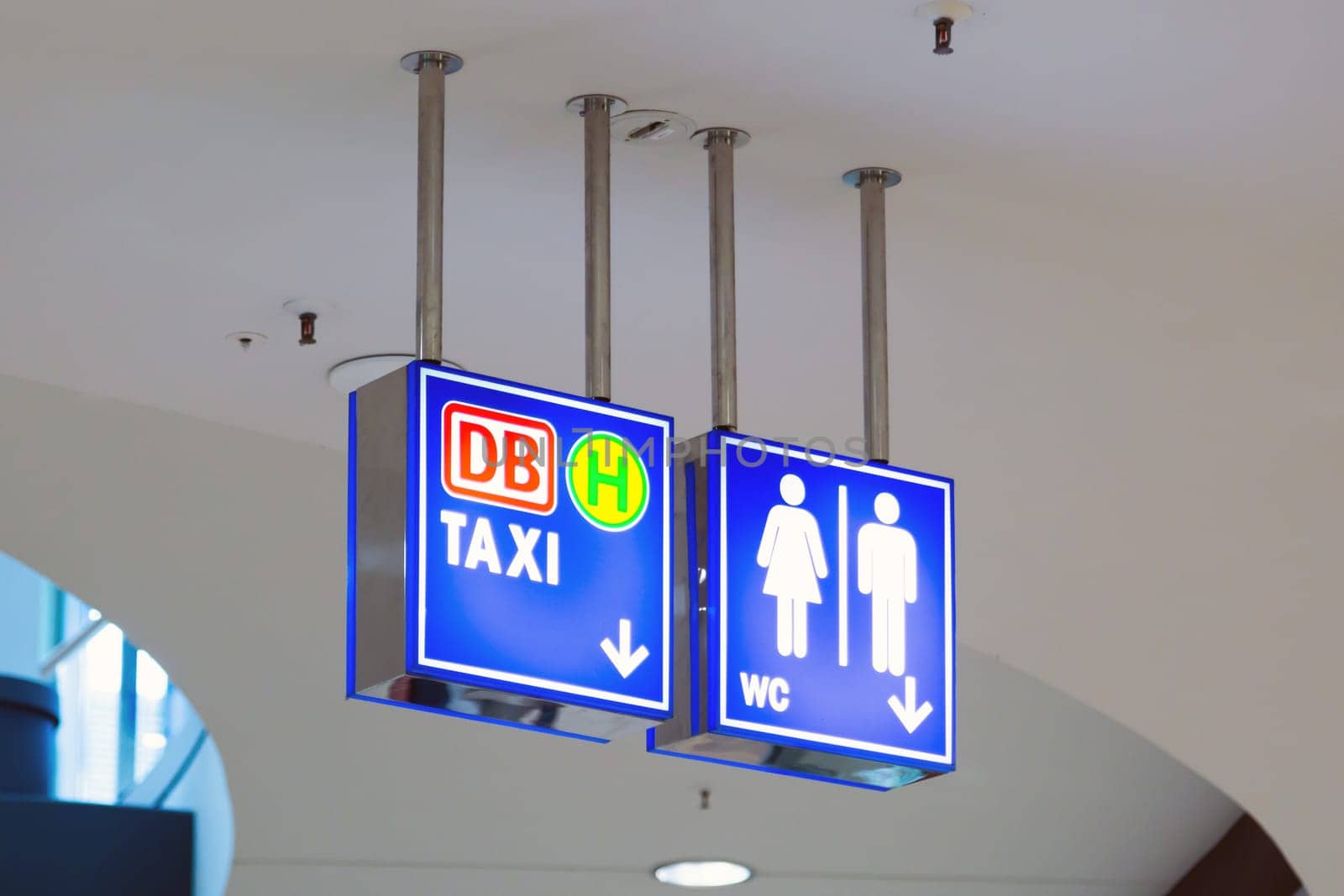 Blue illumintaed neon signs in a public Shopping Mall