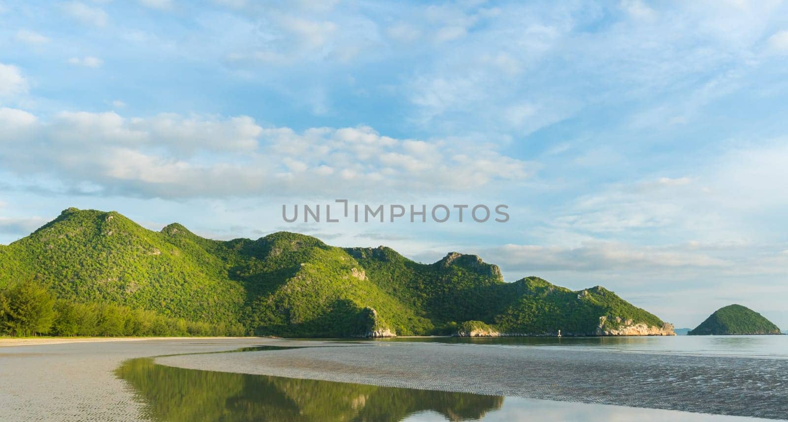 Green Rock or Stone Mountain or Hill and blue sky at Bang Pu Beach Prachuap Khiri Khan Thailand. Landscape or scenery summer season concept