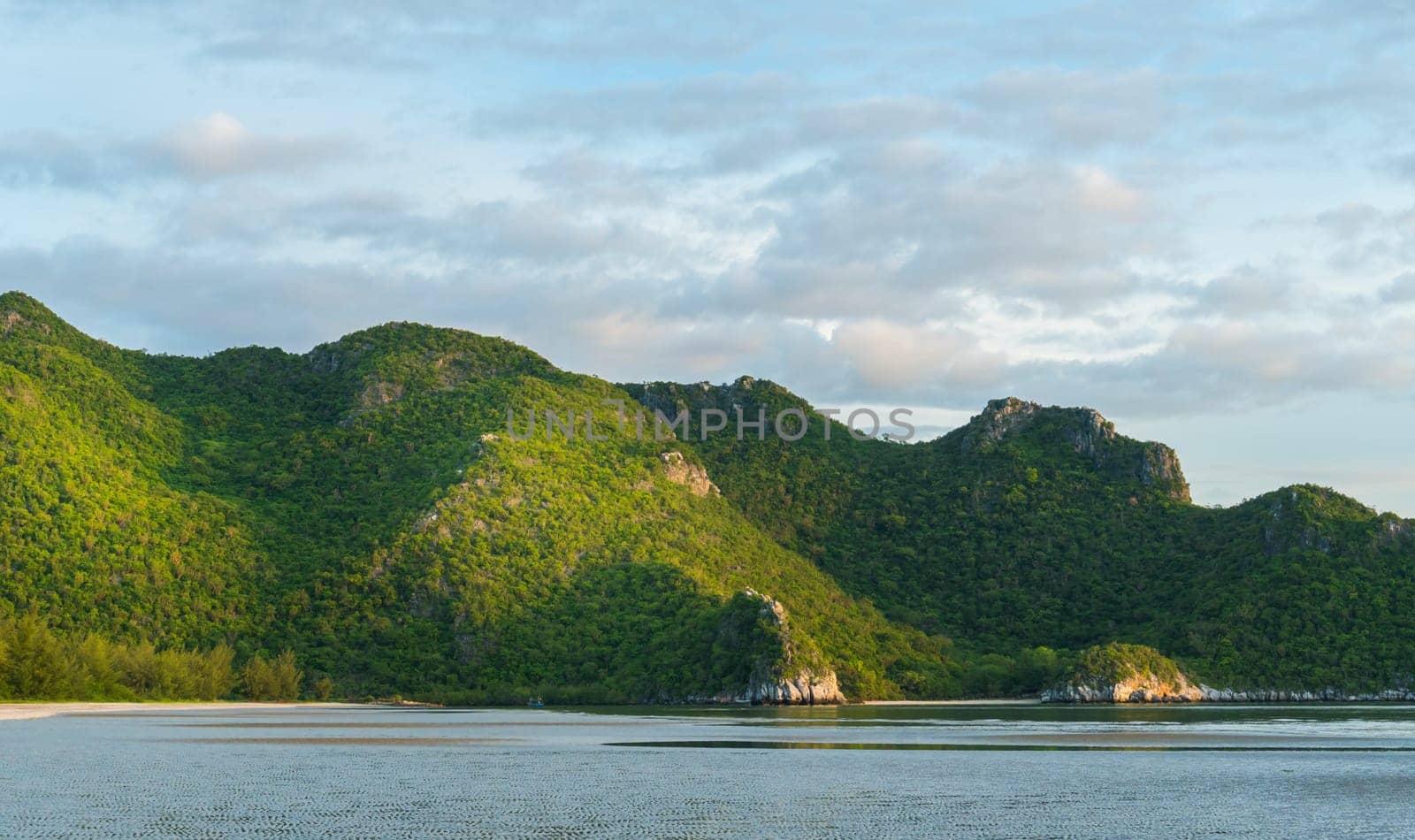 Green Rock or Stone Mountain or Hill and blue sky at Bang Pu Beach Prachuap Khiri Khan Thailand. Landscape or scenery summer season concept