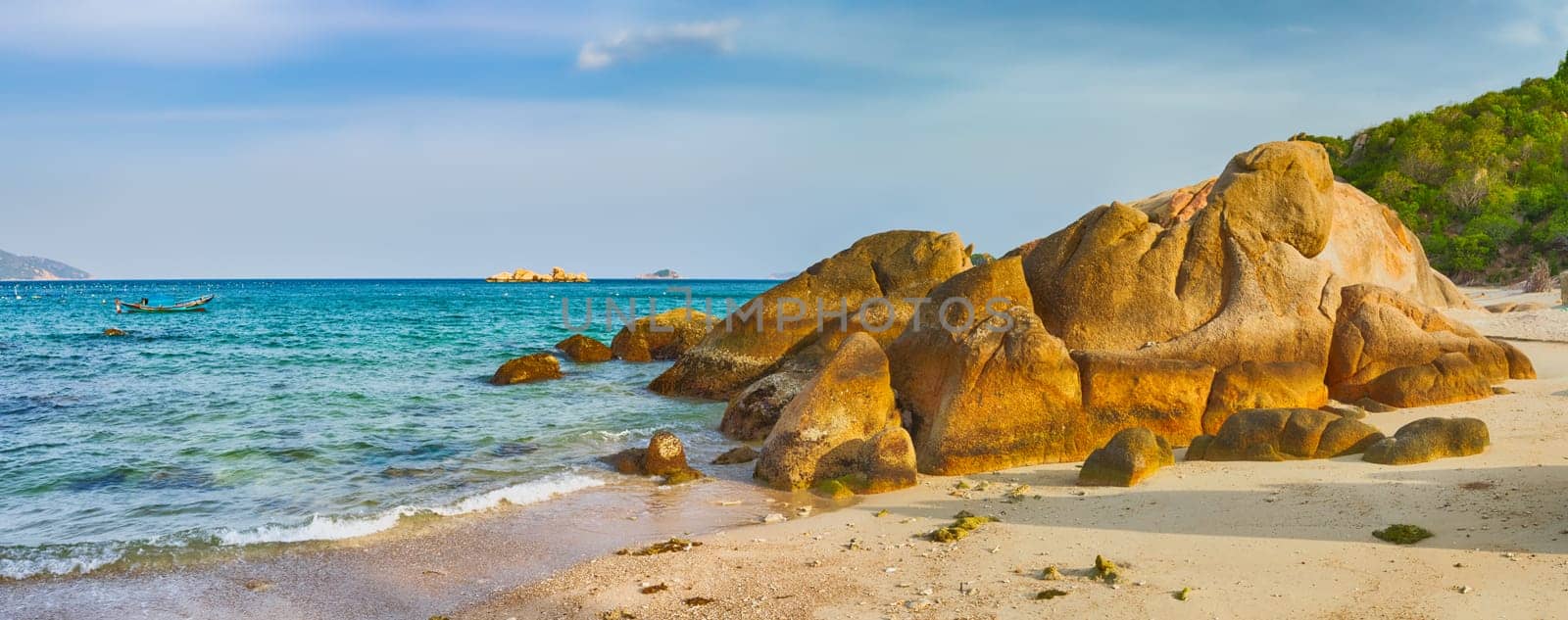Beautiful white sand beach. Stones on a foreground. Landscape of Vietnam. Panorama