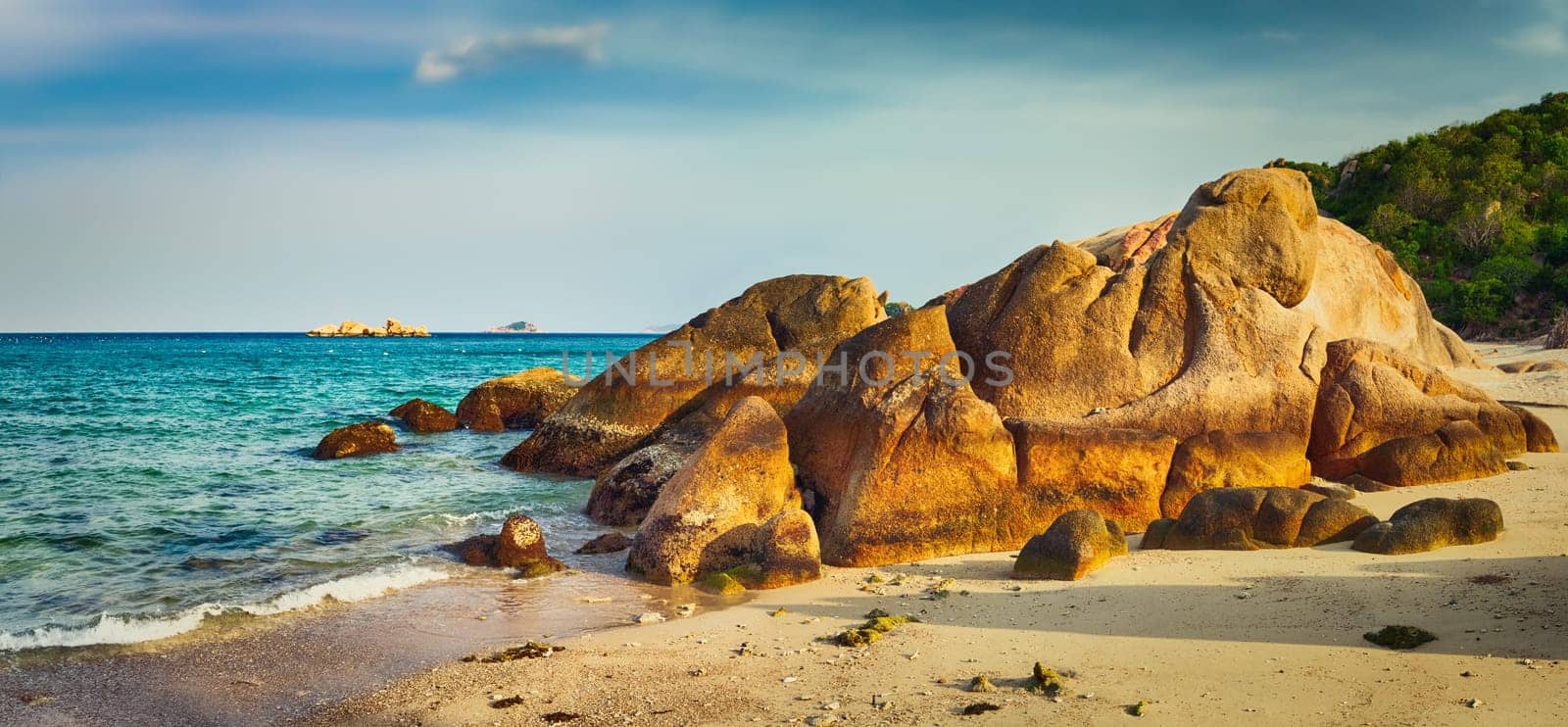 Beautiful white sand beach. Stones on a foreground. Landscape of Vietnam. Panorama