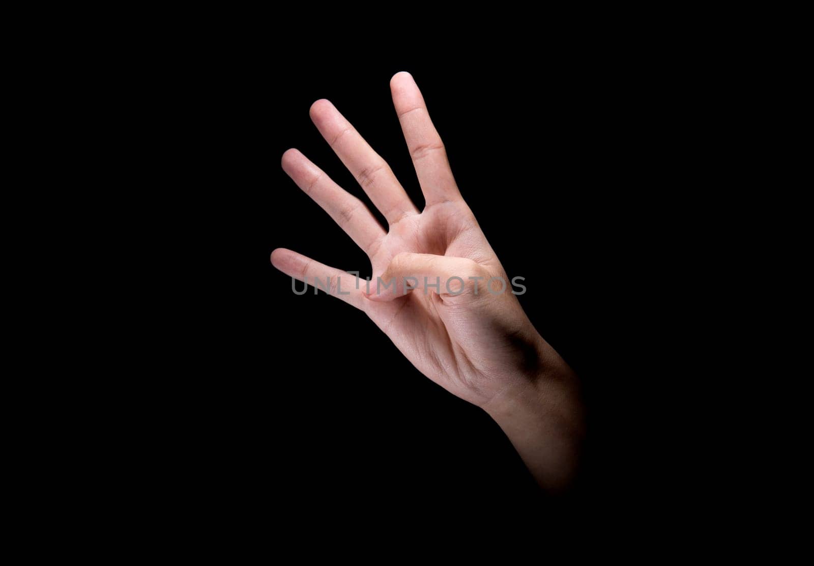 Male hands with four finger sign over dark background