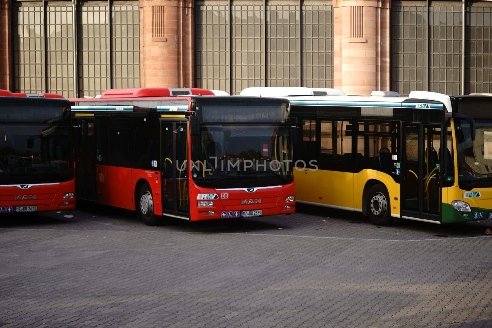 Wiesbaden, Germany - October 07, 2018 Three buses of the Rhine-Main Transport Association stand at the railway station on October 07, 2018 in Wiesbaden..