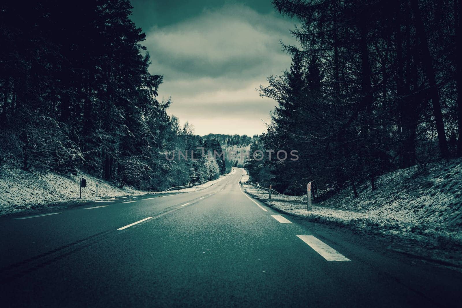 Asphalt road in winter landscape