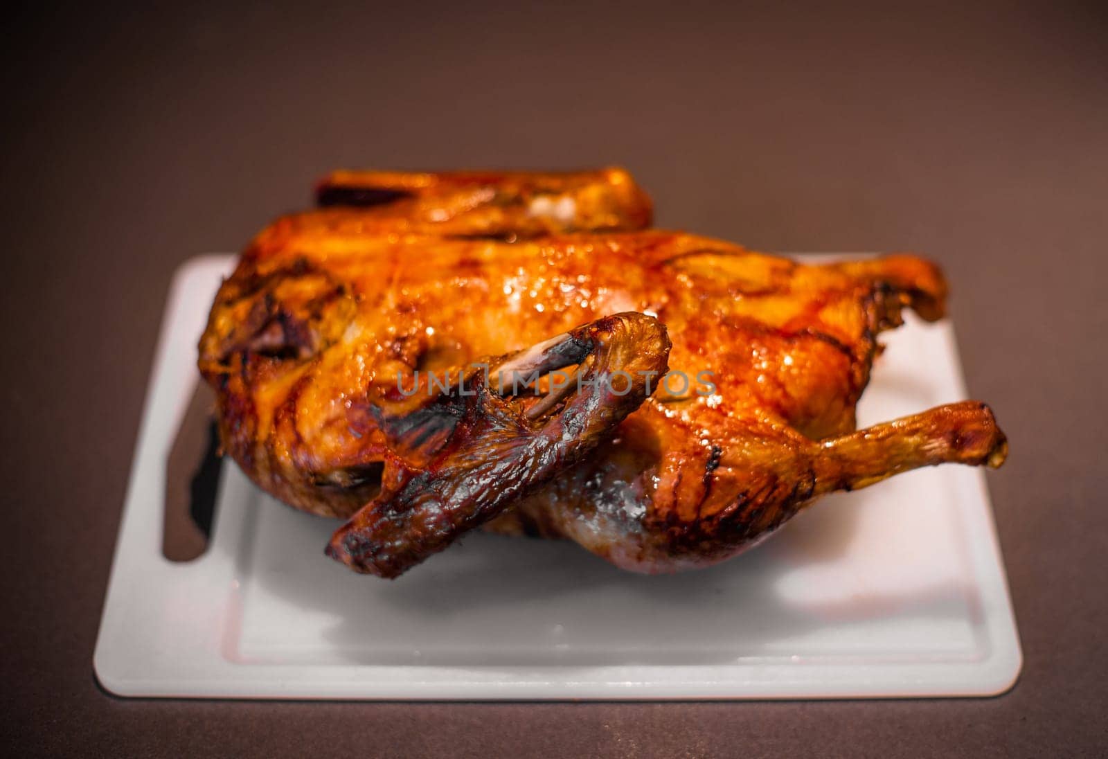 Roasted christmas duck on a kitchen tablle