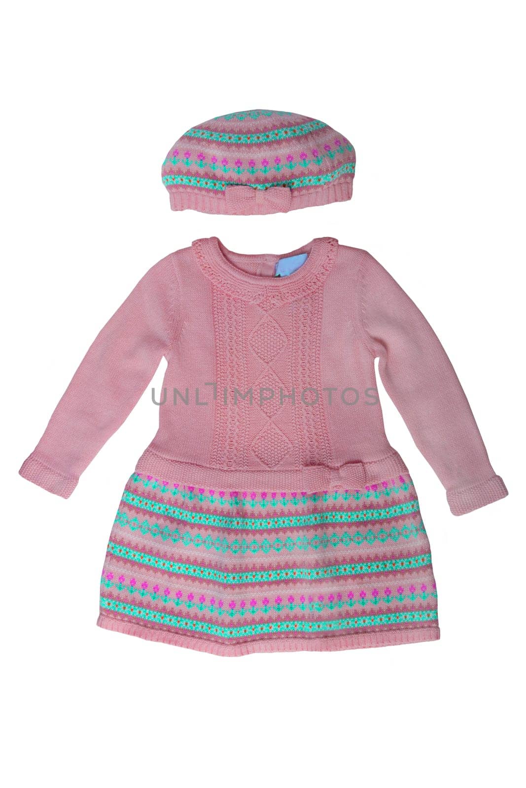 Clothes for children. A beautiful pink bright girl dress and hat with colorful pattern isolated on a white background. Children fashion.