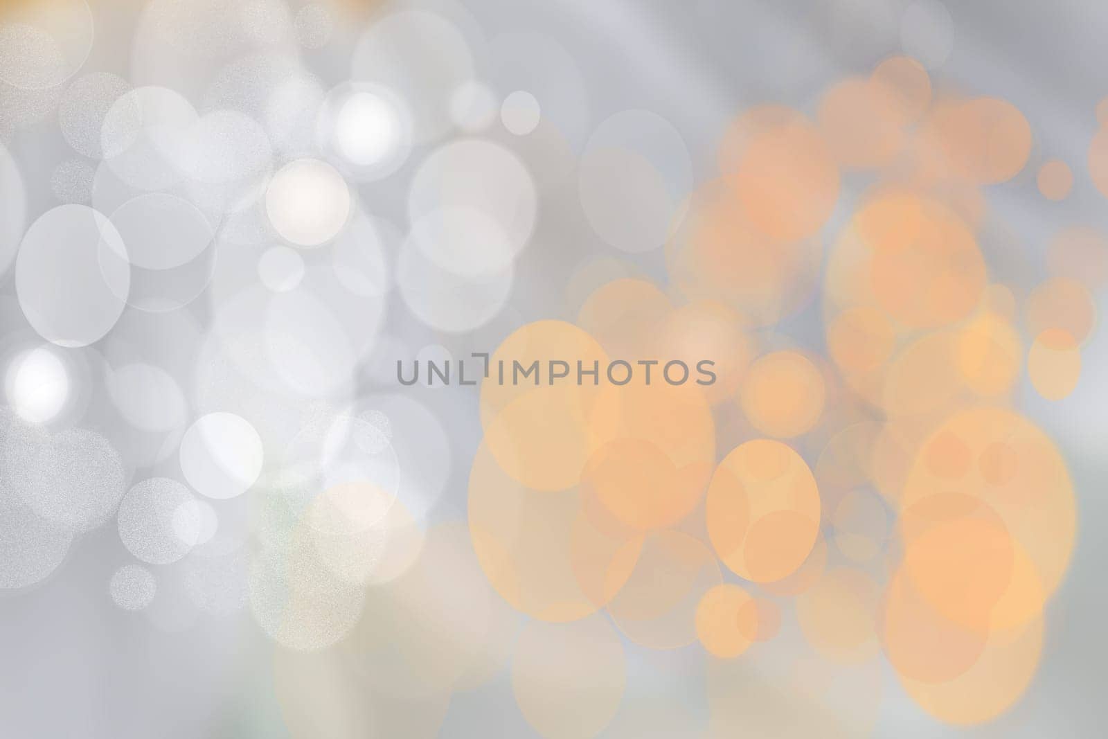 Festive orange silver bright abstract Bokeh with colorful circles. Template for your product display montage. Beautiful texture.