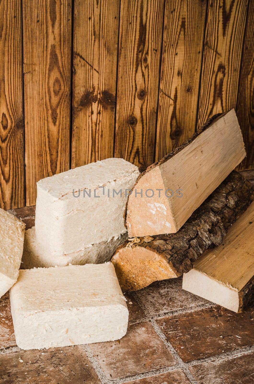 Wood briquette and firewood, close-up