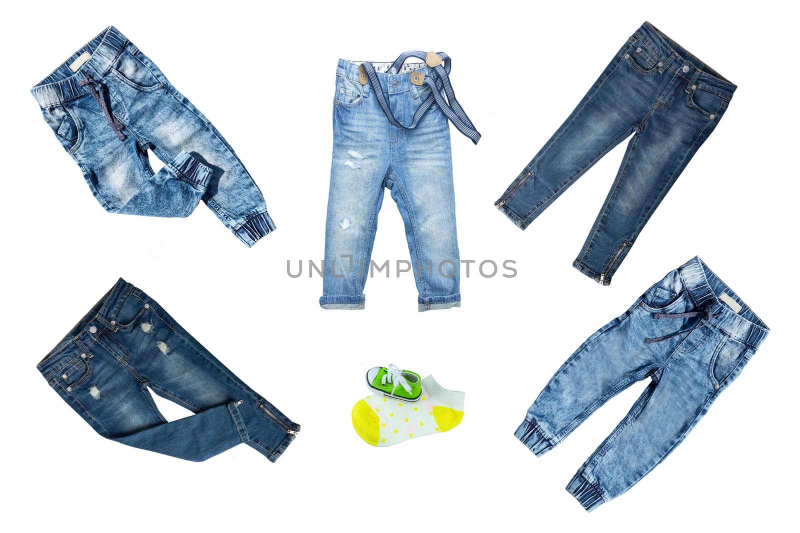 Collection jeans clothes on white background. Collection of blue jeans pants for boys isolated on a white background. Childrens spring and summer fashion.