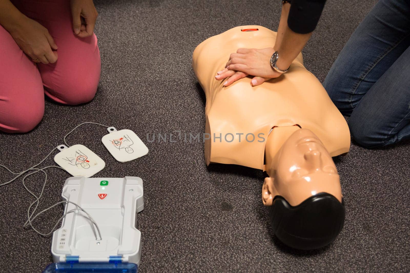 First aid cardiopulmonary resuscitation course using automated external defibrillator device, AED.