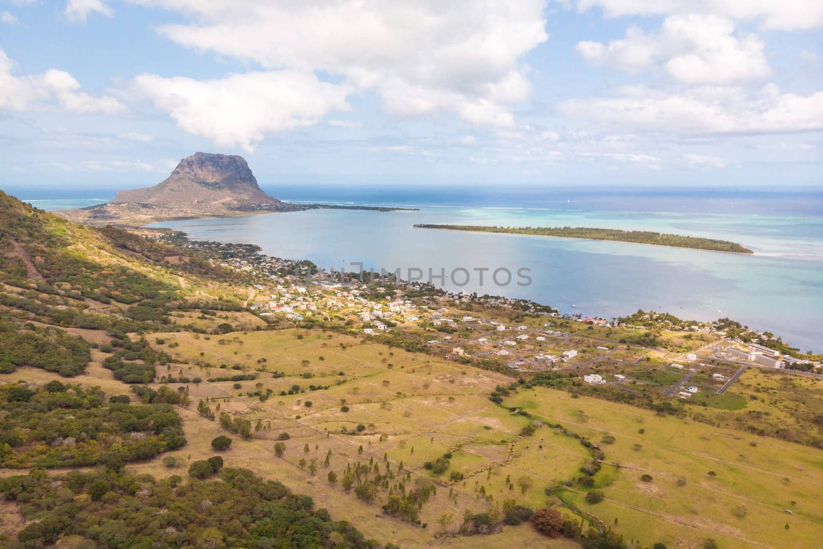 Aerial view of La Gaulette, popular kitesurfing tourist town with Le Morne Brabant mountain, the World Heritage UNESCO site seen in the background.