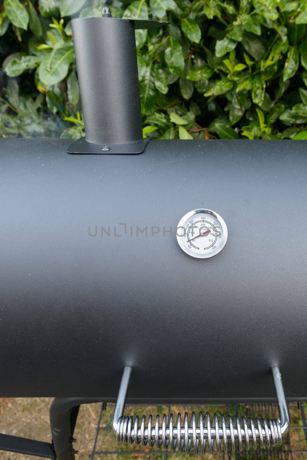 A black barbecue ready for grilling a slow cook pulled pork and ribs