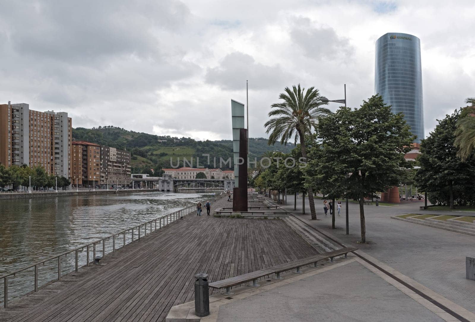 bilbao downtown with nervion river and boardwalk area, basque country, spain.