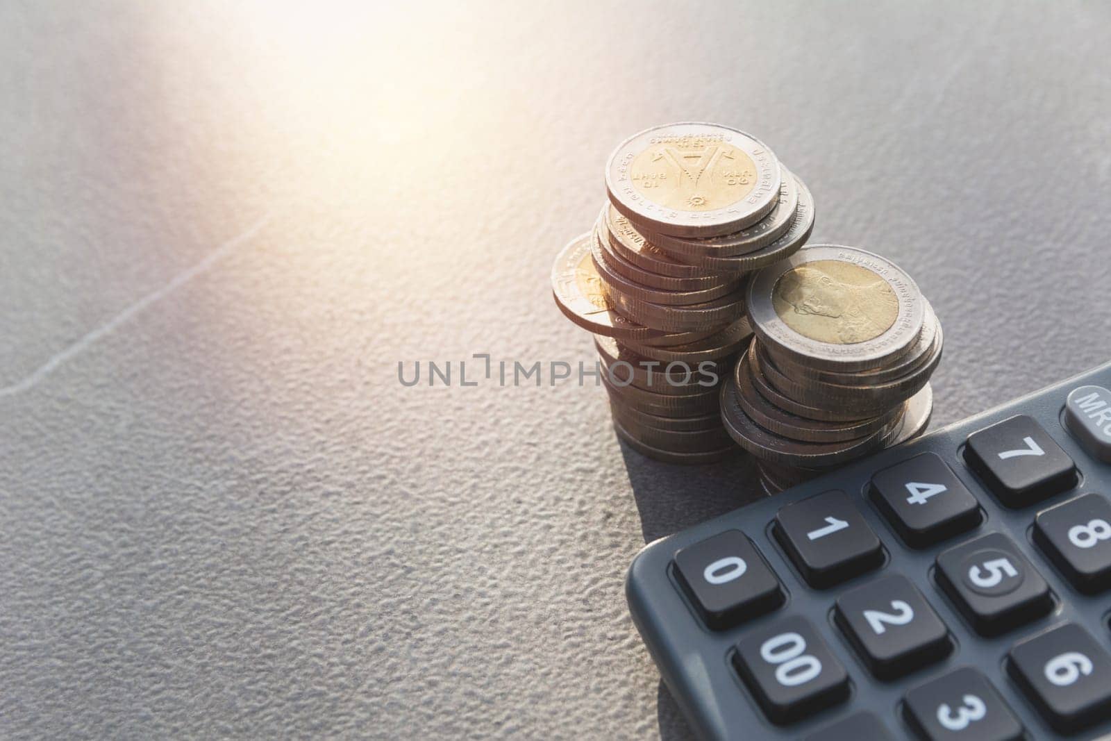 Stock financial indices with stack coin and calculator. Financial stock market in accounting market economy analysis.