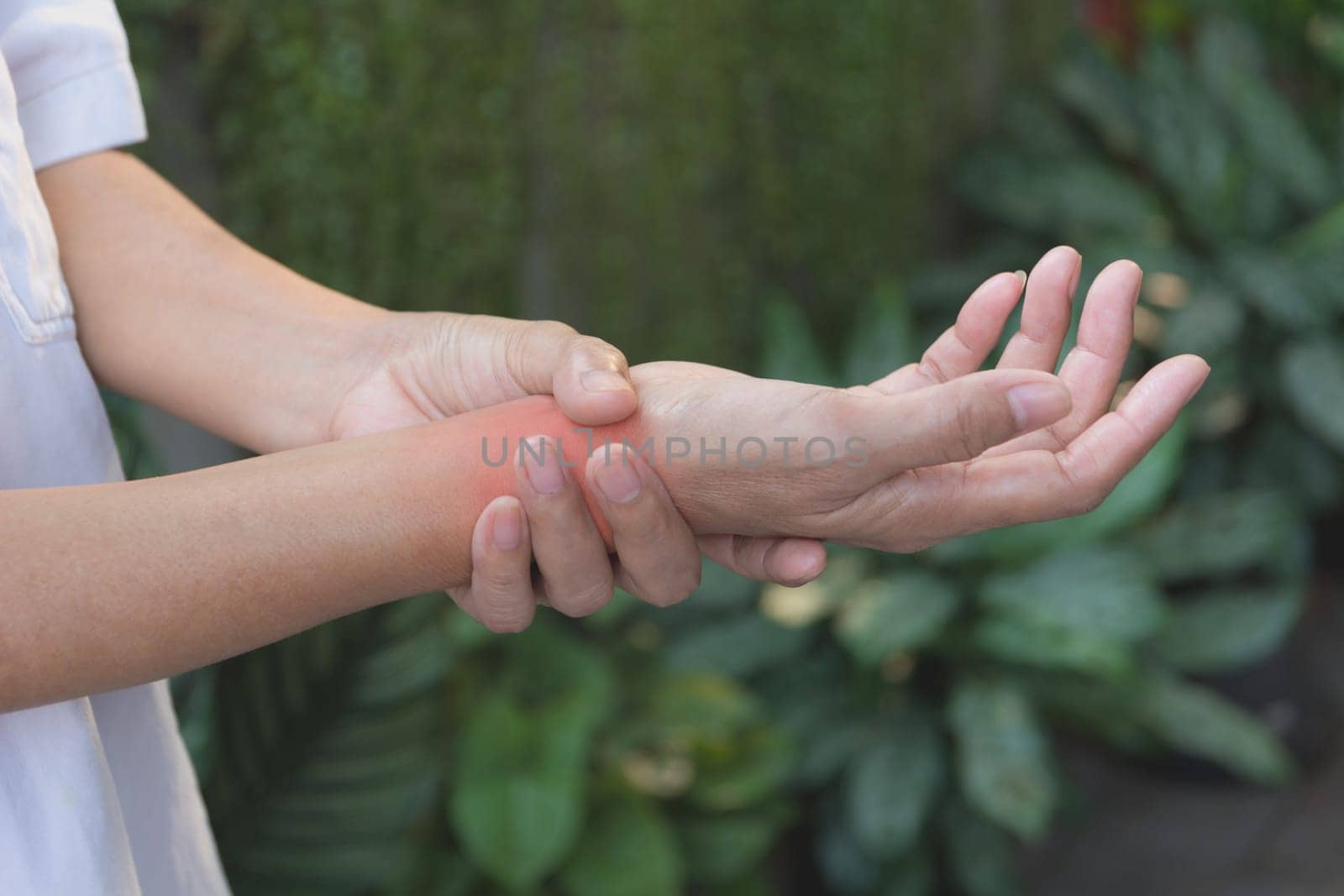 Man holding his wrist. Pain in a man wrist. Man massaging painful wrist. pain concept.
