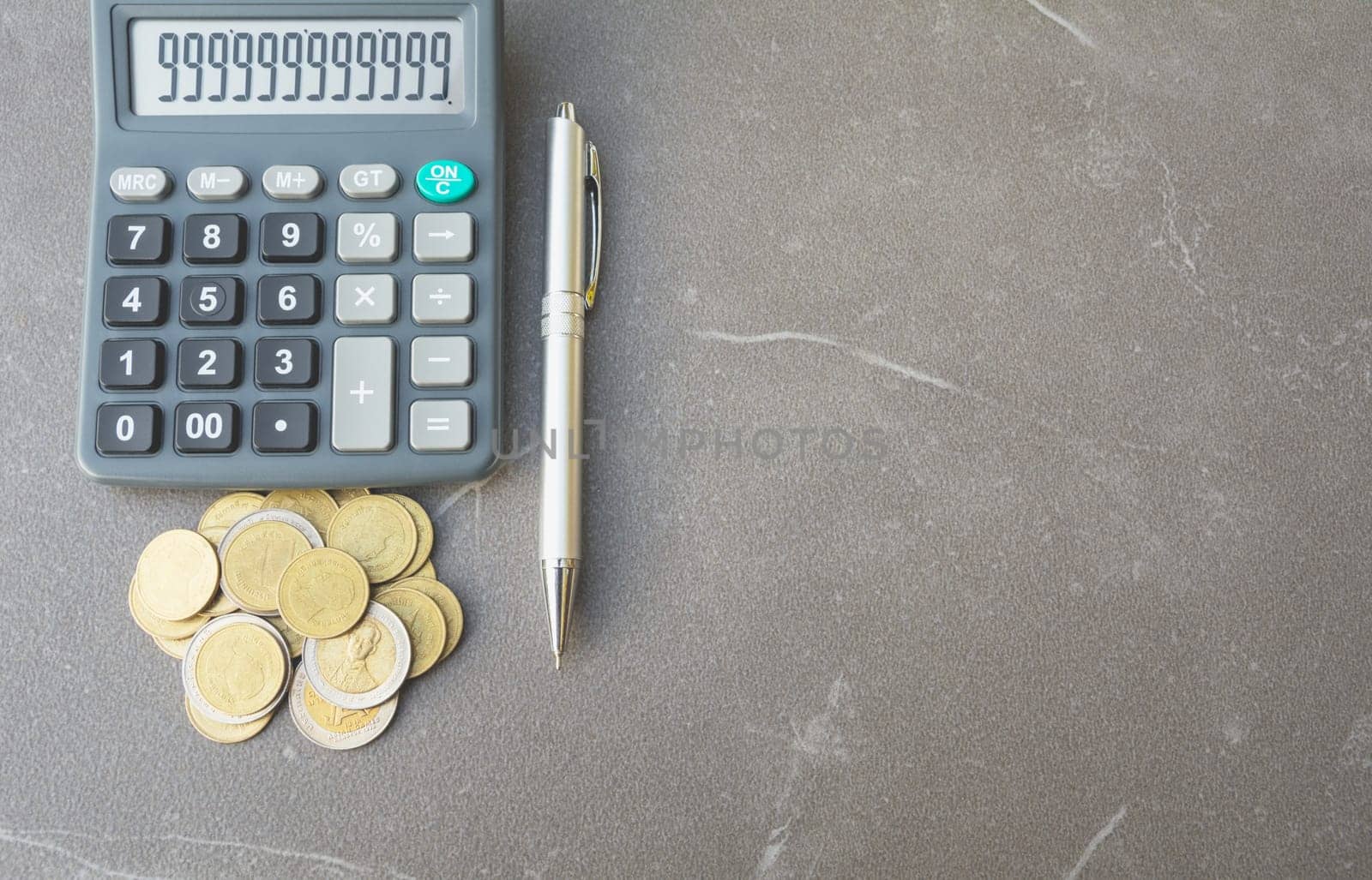 Stock financial indices with stack coin and calculator. Financial stock market in accounting market economy analysis.