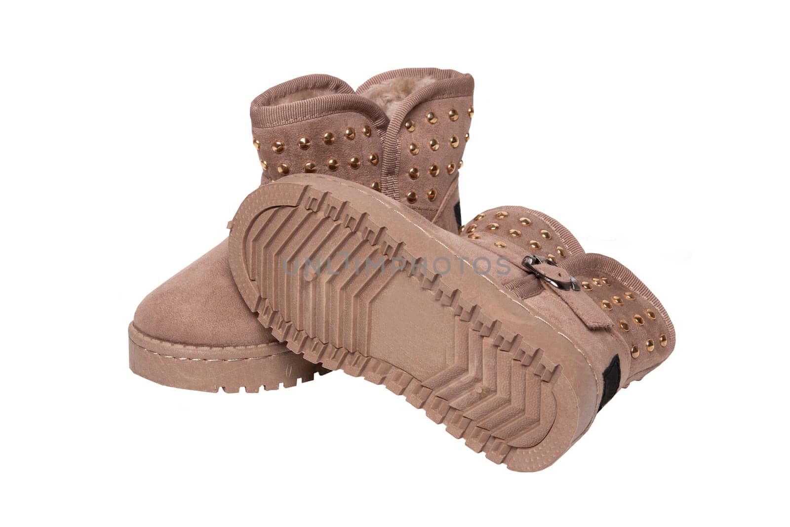 Winter boots. A pair brown suede leather winter boots and lined with fur.  Isolated on a white background. Shoe fashion new collection winter 2018 to 2019.