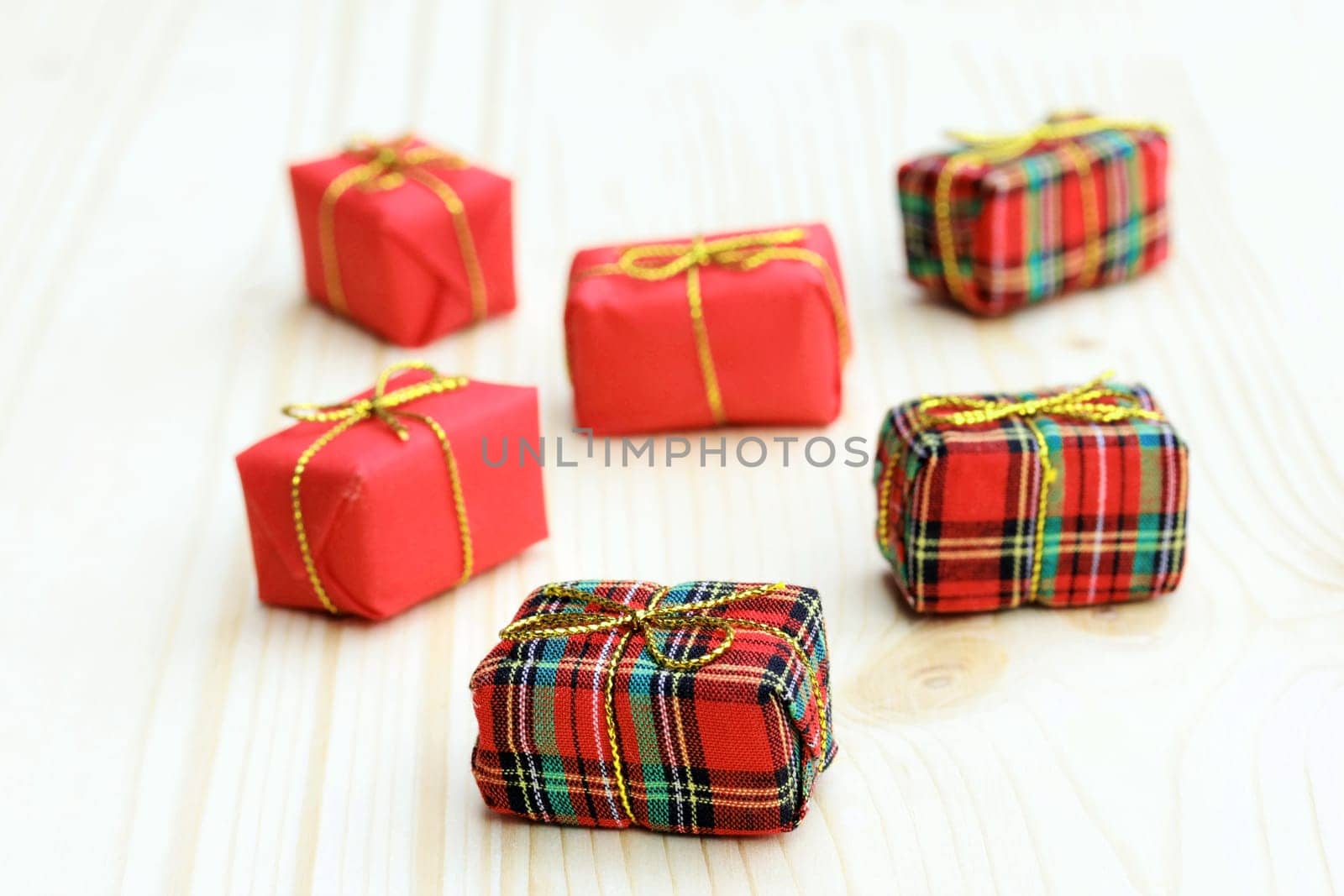 Six little red Christmas parcels. Gifts for Christmas and Advent