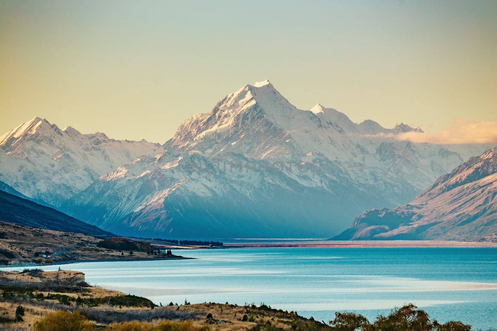 Road to Mt Cook, the highest mountain in New Zealand. Scenic highway drive along Lake Pukaki in Aoraki Mt Cook National Park, South Island of New Zealand.
