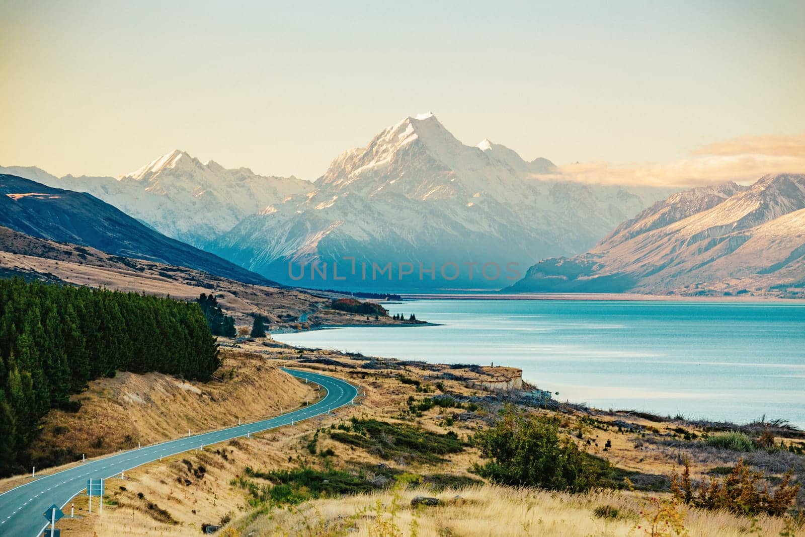 Road to Mt Cook, the highest mountain in New Zealand. Scenic highway drive along Lake Pukaki in Aoraki Mt Cook National Park, South Island of New Zealand.