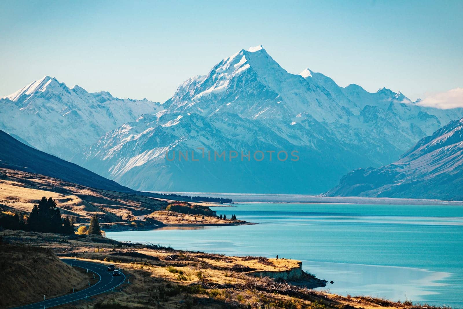 Road to Mt Cook, the highest mountain in New Zealand. Scenic highway drive along Lake Pukaki in Aoraki Mt Cook National Park, South Island of New Zealand.