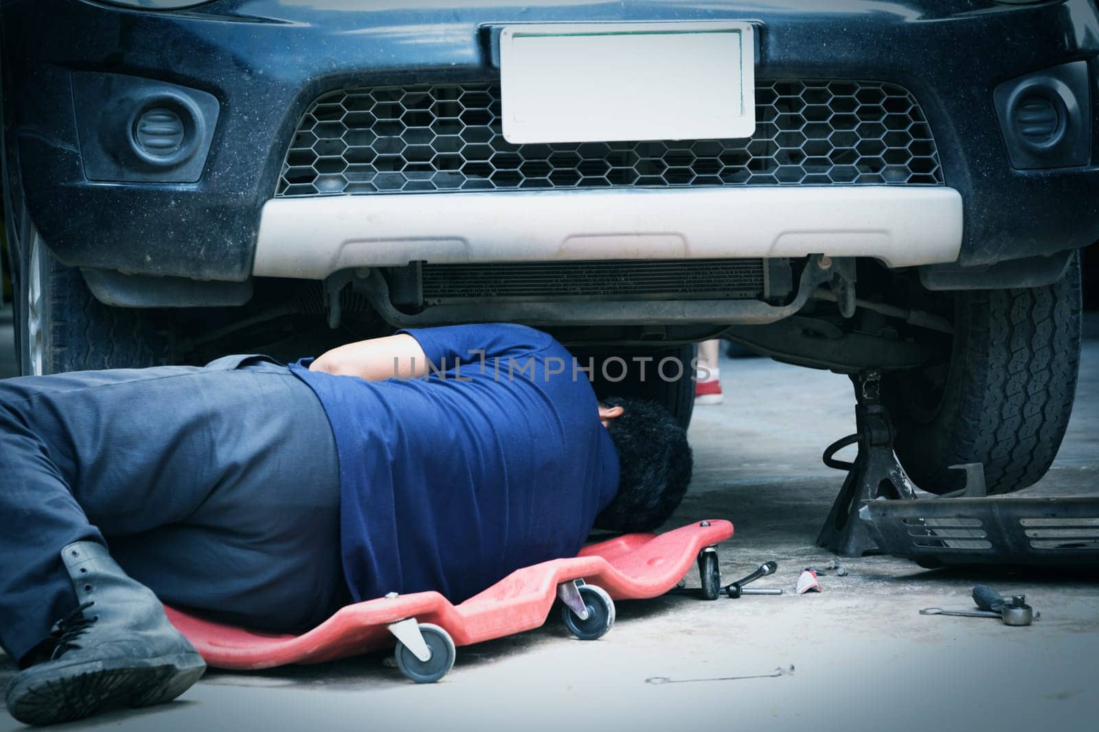 Technician checking engine of car. Auto mechanic checking car engine. Maintenance checking car.