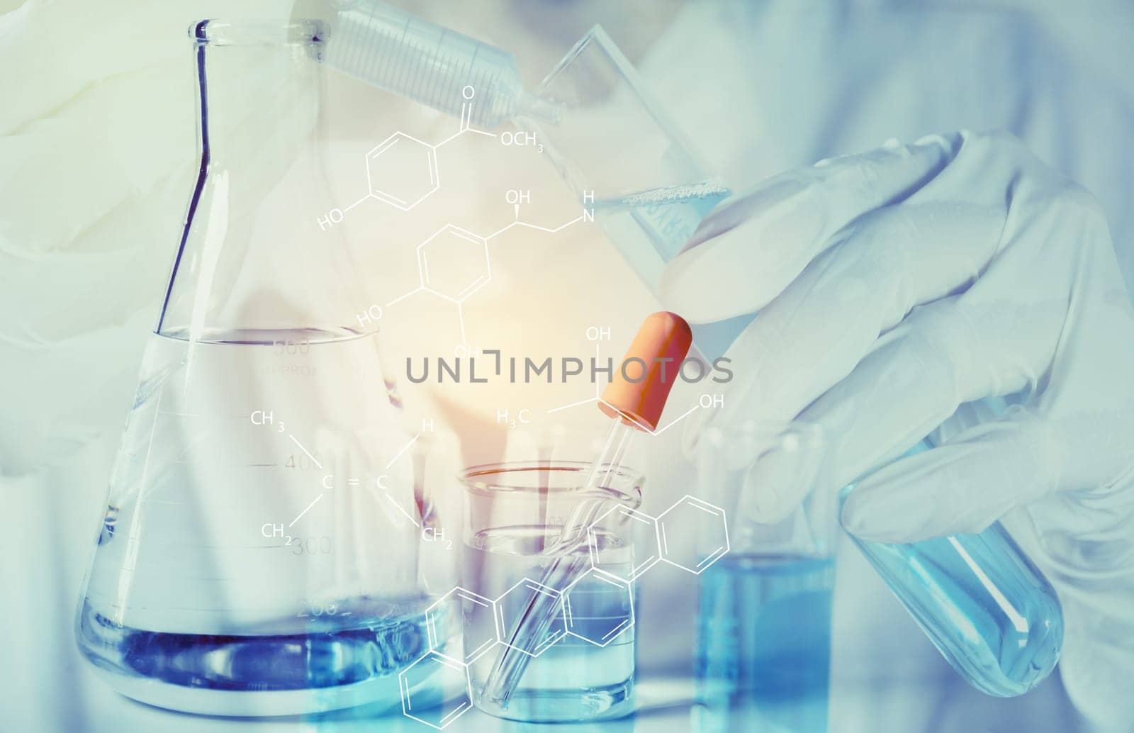 Researcher with glass laboratory chemical test tubes with liquid for analytical , medical, pharmaceutical and scientific research concept.