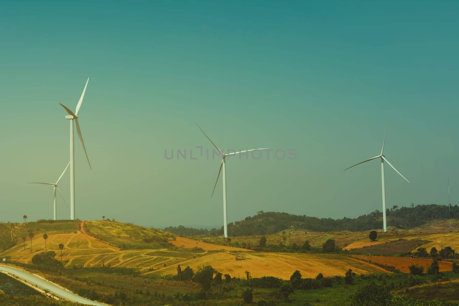 Wind turbines under the sky for technology concept. Wind turbines generating electricity.