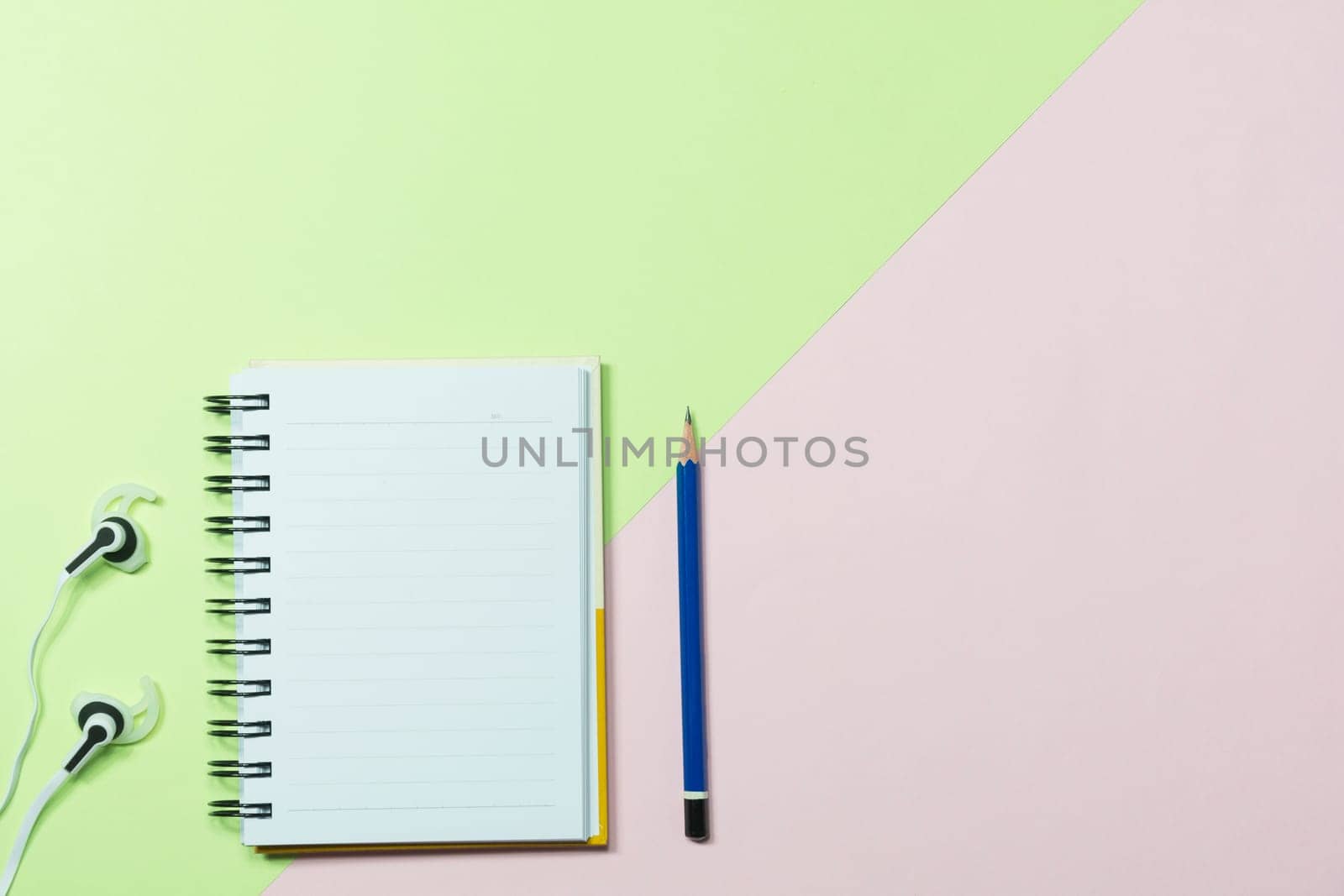 Top view of pencil and notebook on colorful background and copy space for insert text.