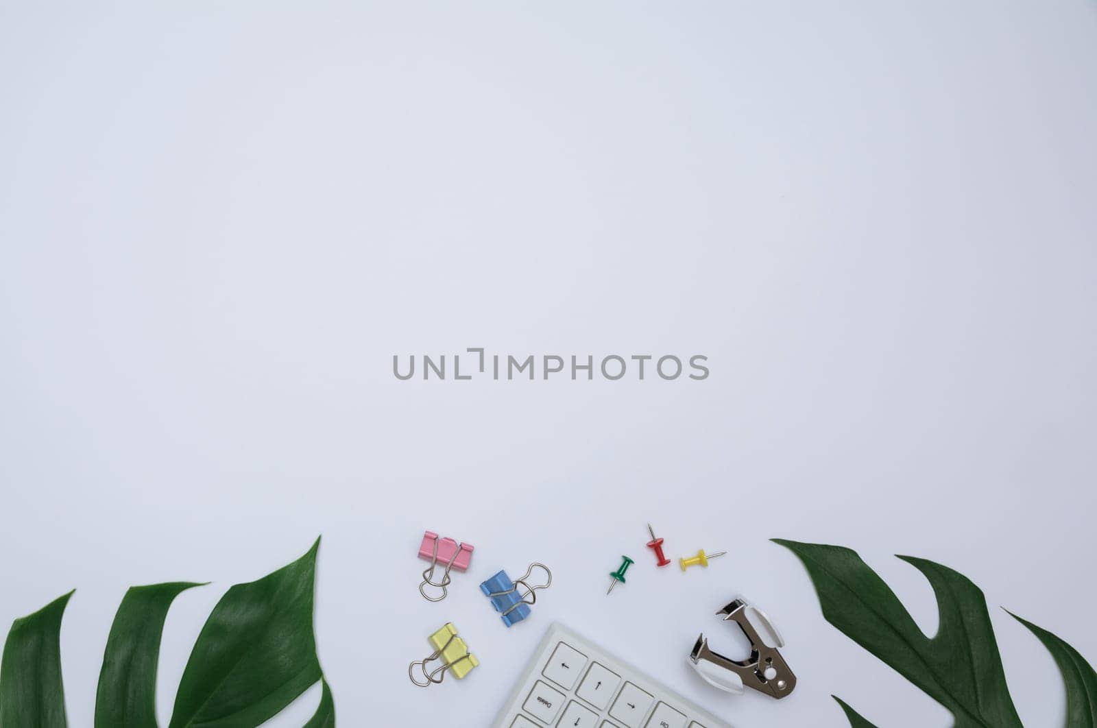 Top view of office supplies and notebook on white background and copy space for insert text.