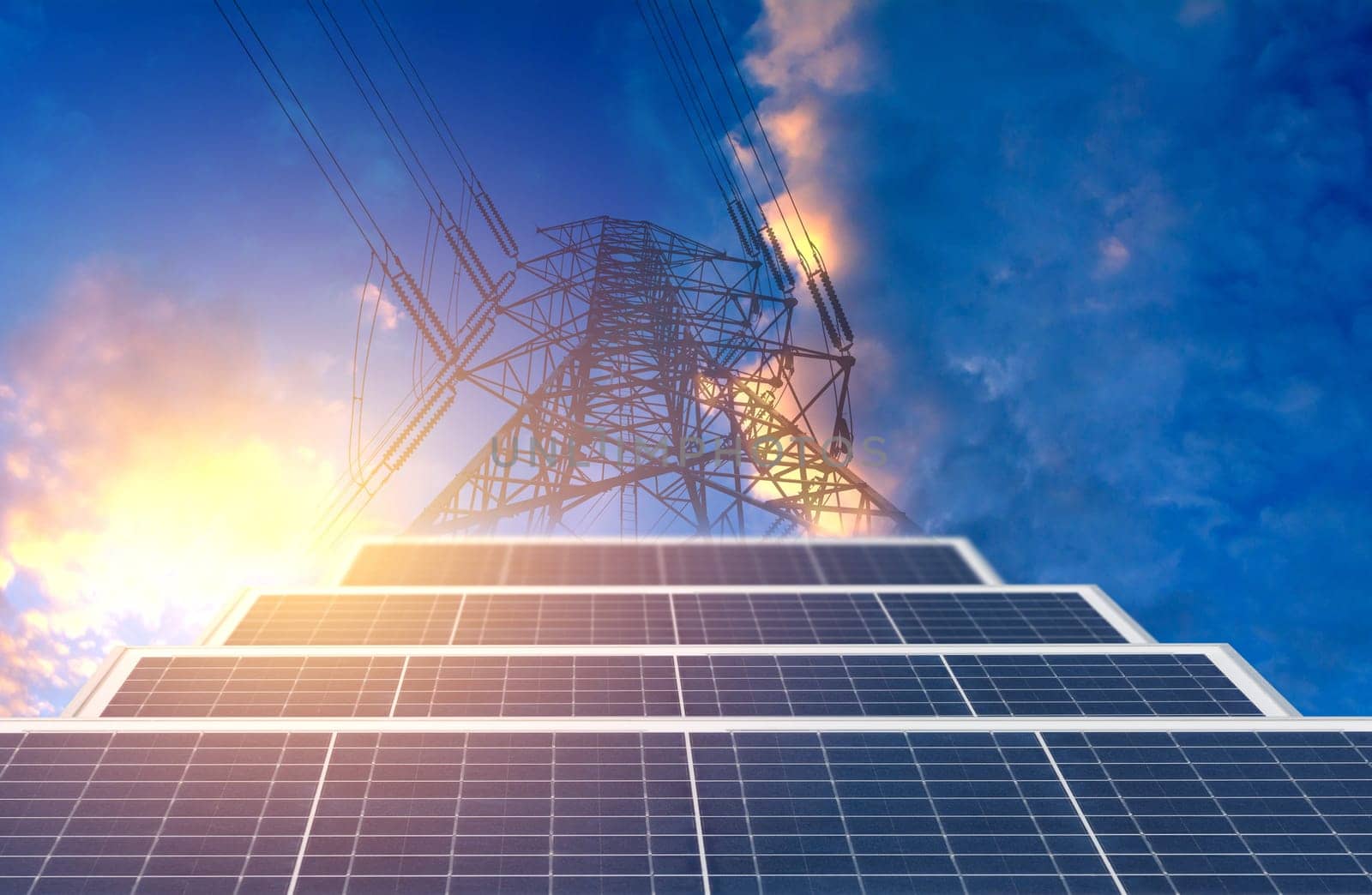 High voltage pole with solar cell on blue sky background for energy and power concept. High voltage tower.