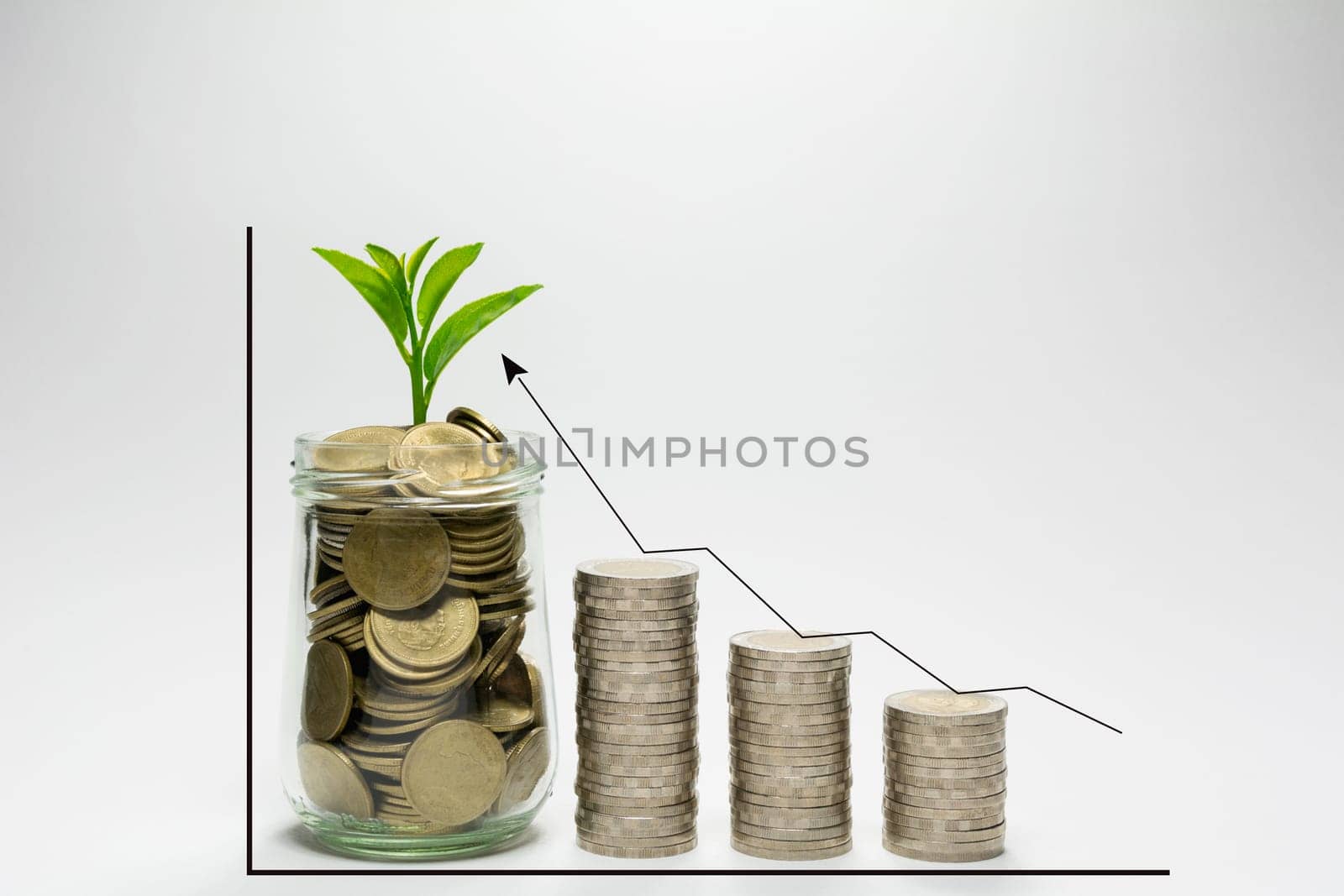 Money coin in glass jar with stack of coins isolated on white background. Financial and accounting concept.