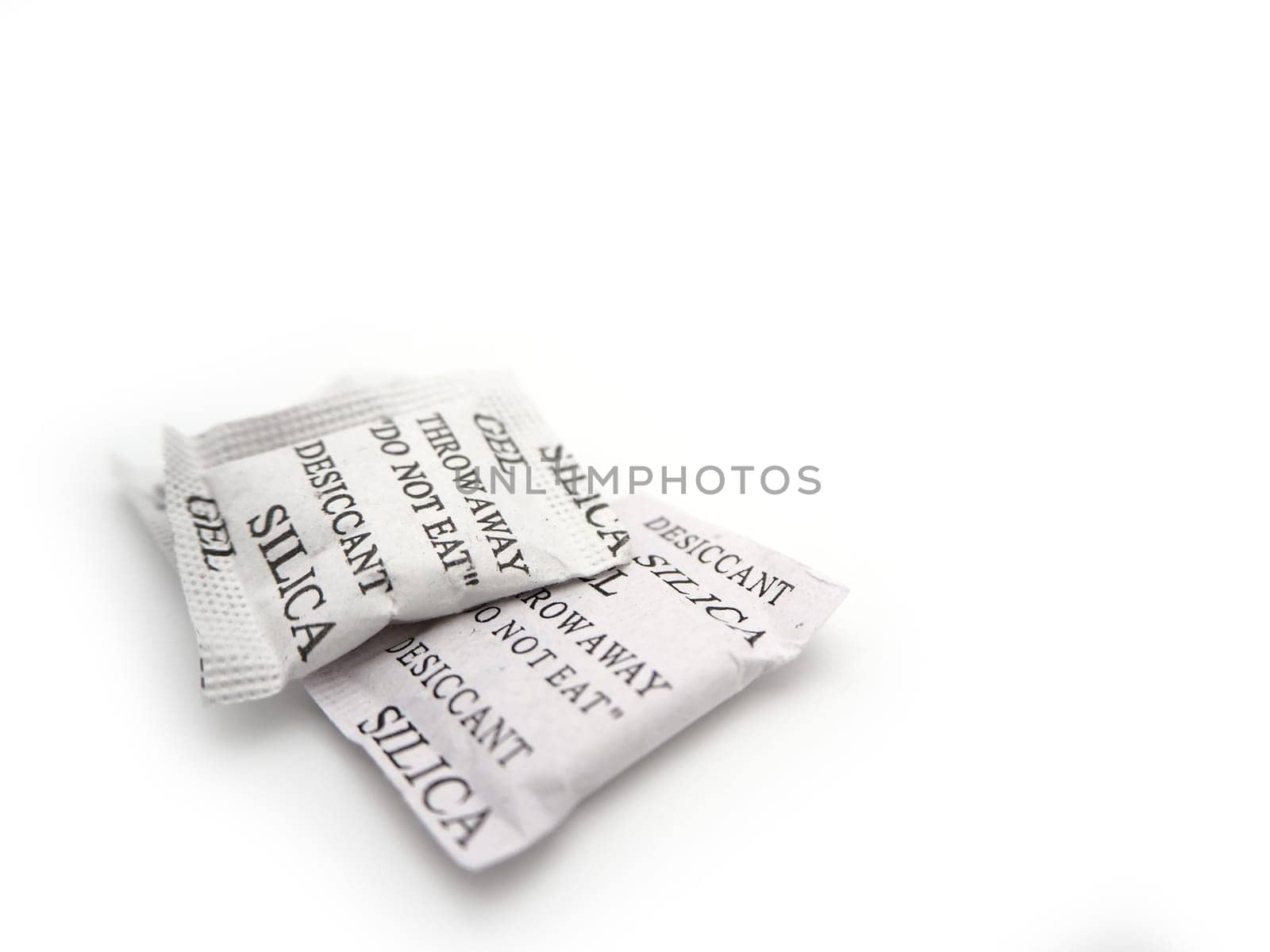 Silica gel packets isolated on a white background.