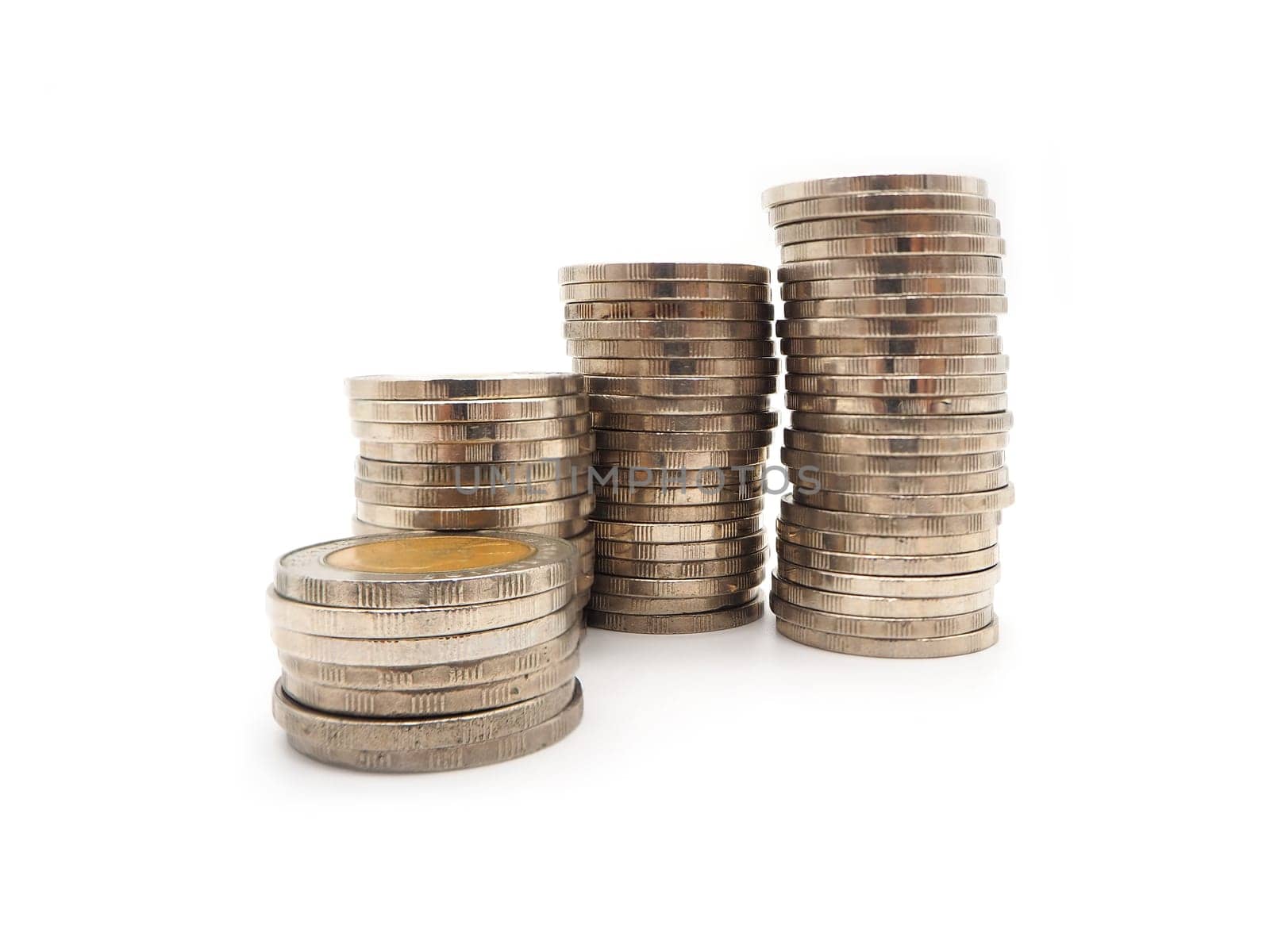 Saving money concept with money coin stack isolated on white background. Financial and accounting concept.