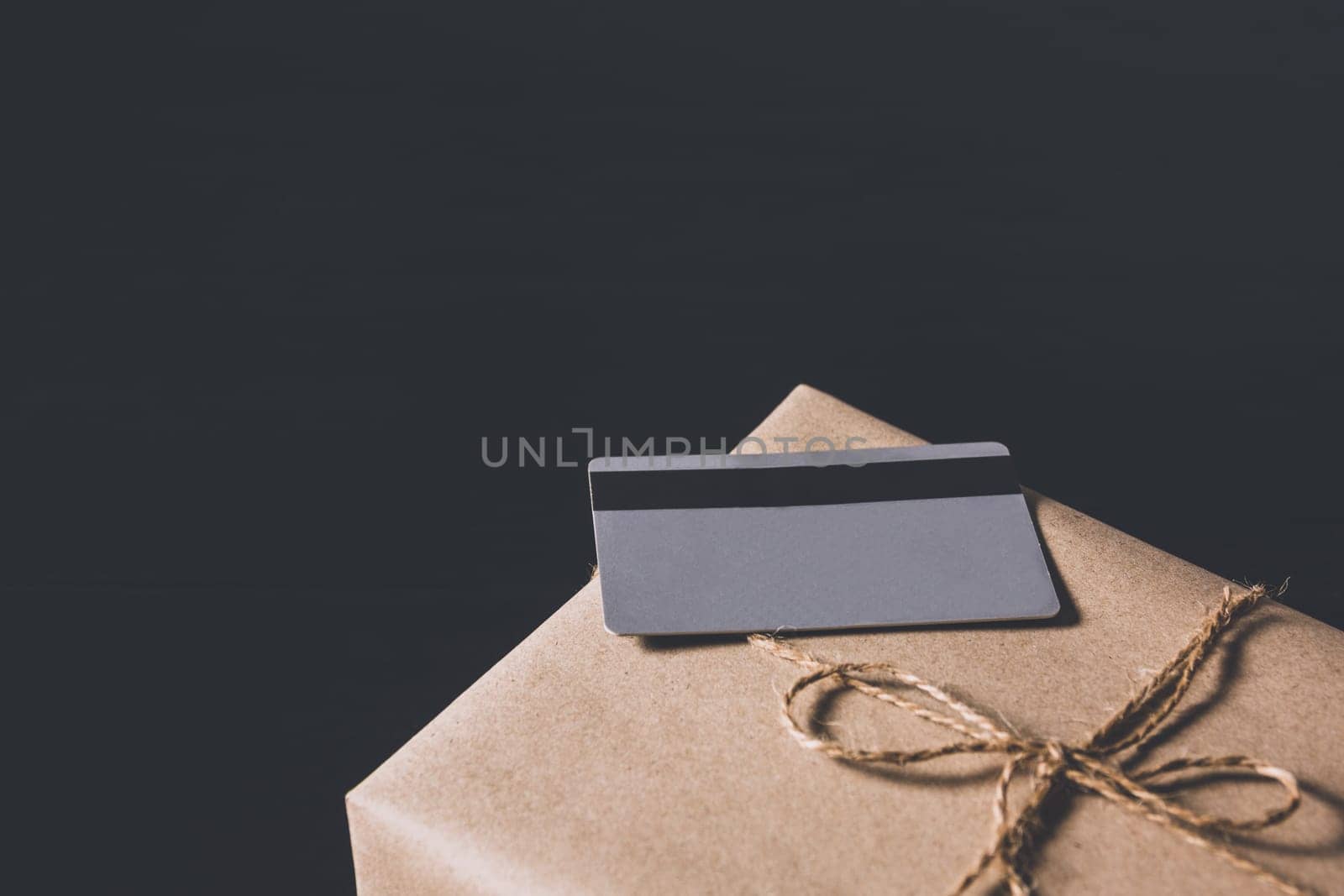 The grey credit card on a box for online shopping and business concept.