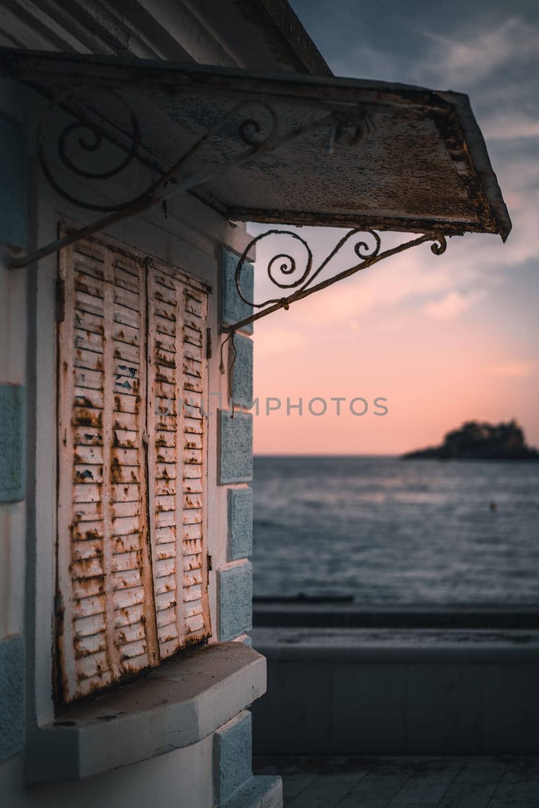Closed rusty metal shutters of a local cafe in Petrovac, Montenegro