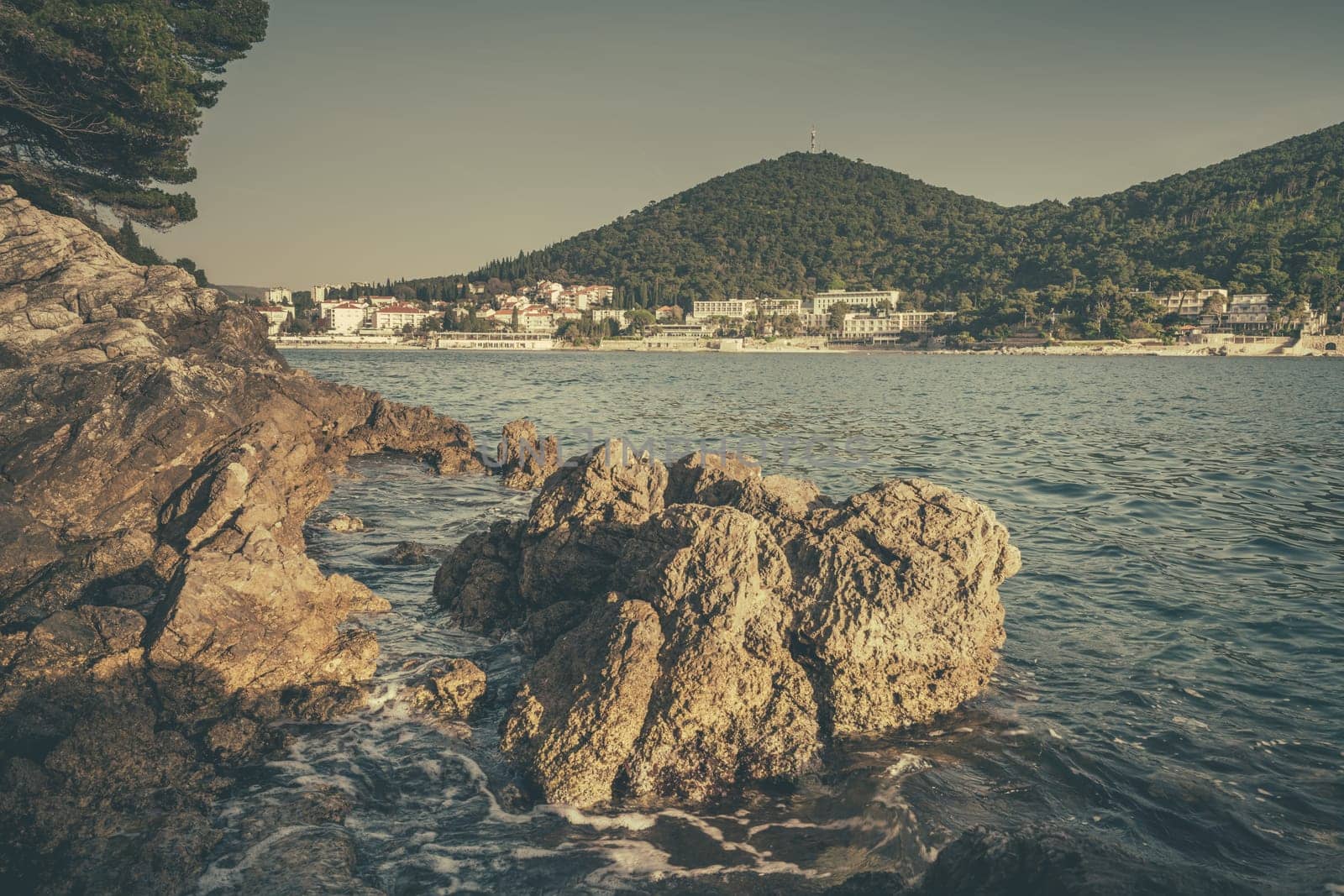 Beautiful rocky Croatian coast in Dubrovnik Lapad area in summer, Croatia