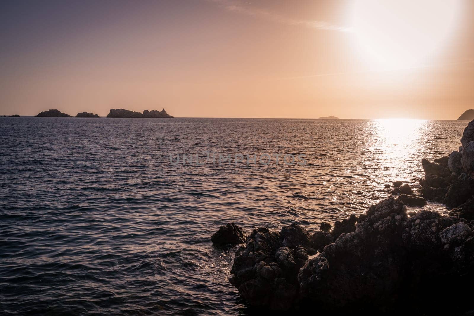 Sunset over the rocky Croatian coast in Dubrovnik, Croatia