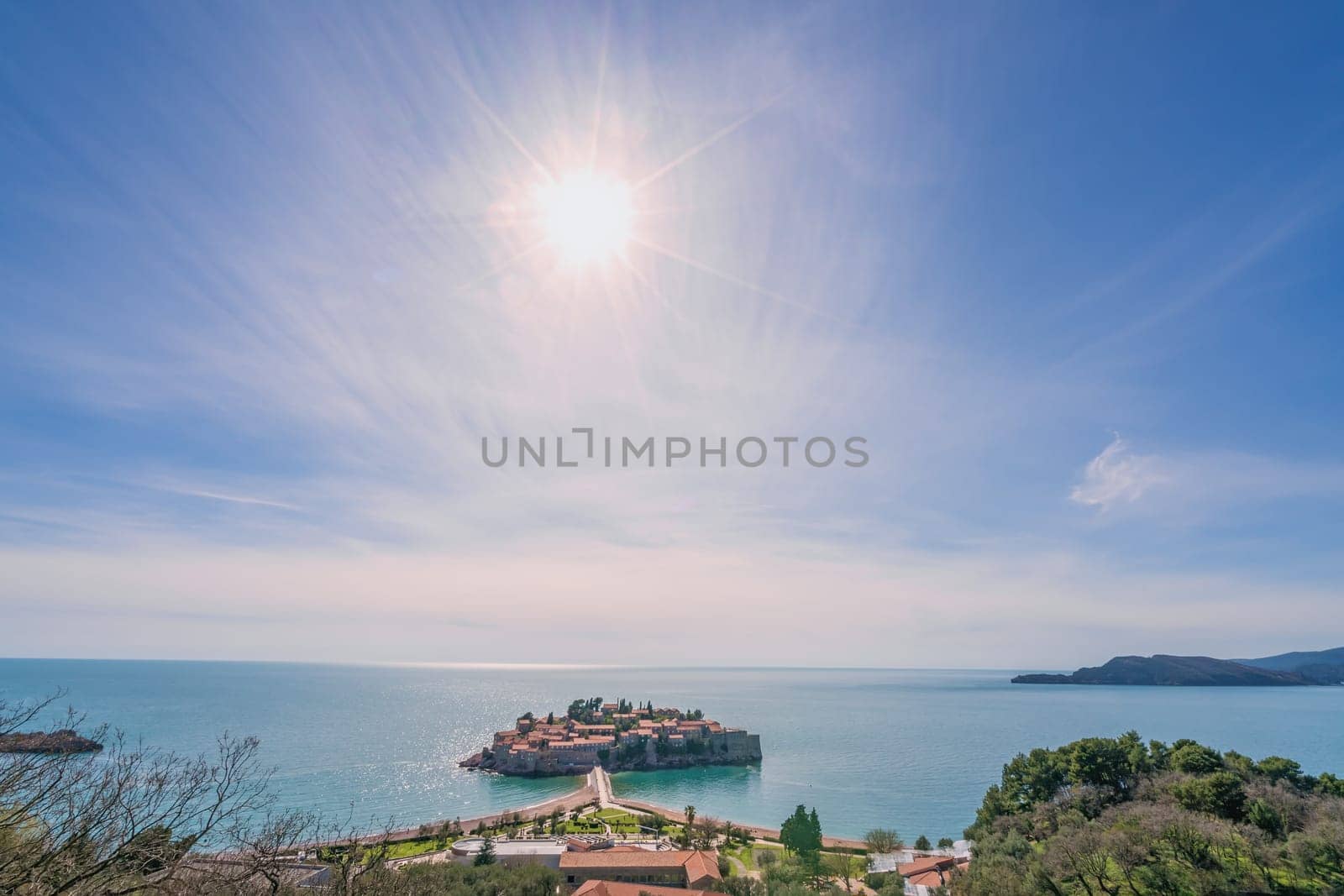 Historical Sveti Stefan old town at midday, landmark on the coast of Montenegro