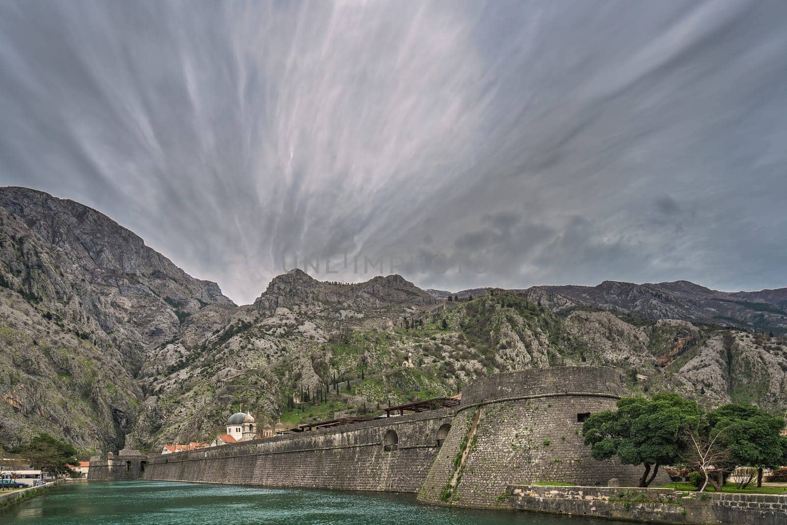The massive walls of the fortification Bastion Riva by the river Shkurda in Kotor Old Town, Montenegro