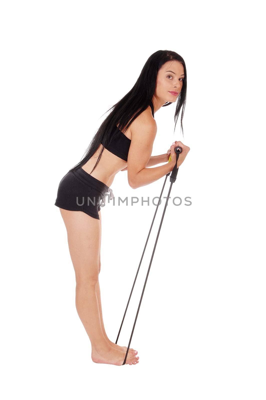 A young slim woman standing bare feet isolated for white background.and exercising with a robe, with long black hair.