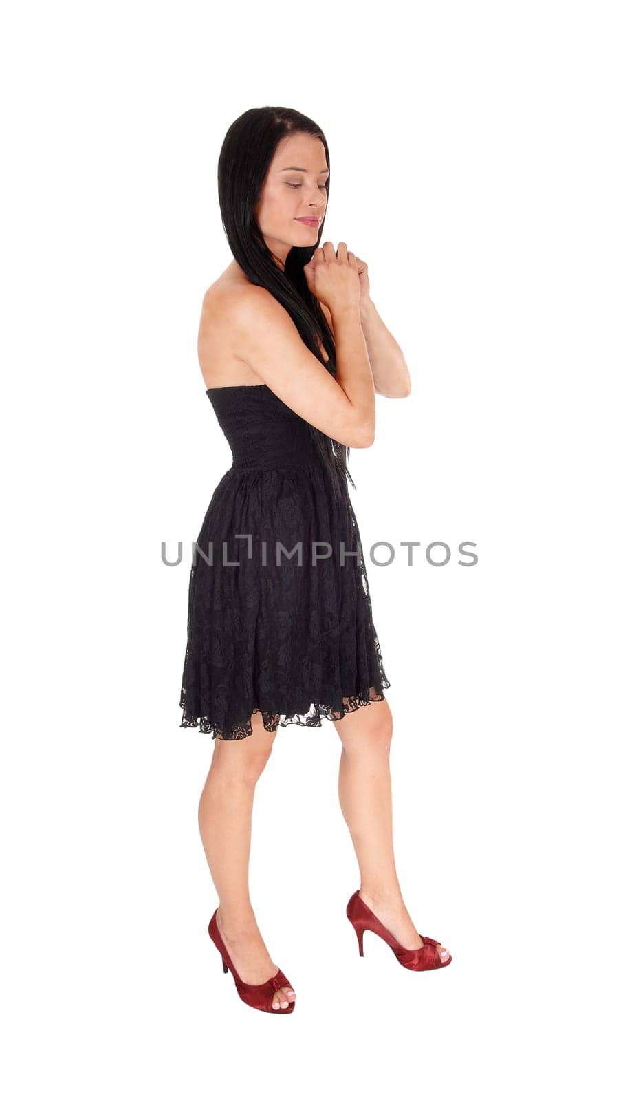 A full body image of a beautiful woman praying with her hands folded.and long black hair, eye's are closed, isolated for white background.