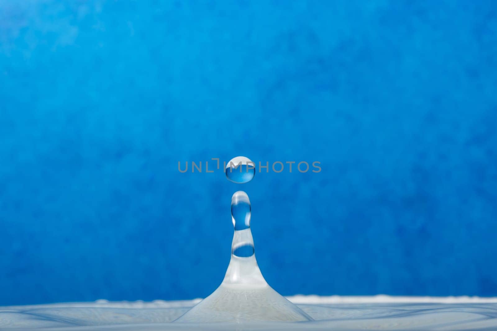 Water Droplet Falling into Water.