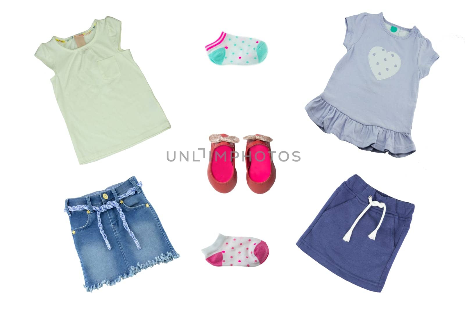 Summer fashion. Collage set of baby child girl clothes isolated on a white background. T-shirts, skirts, shoes and socks.